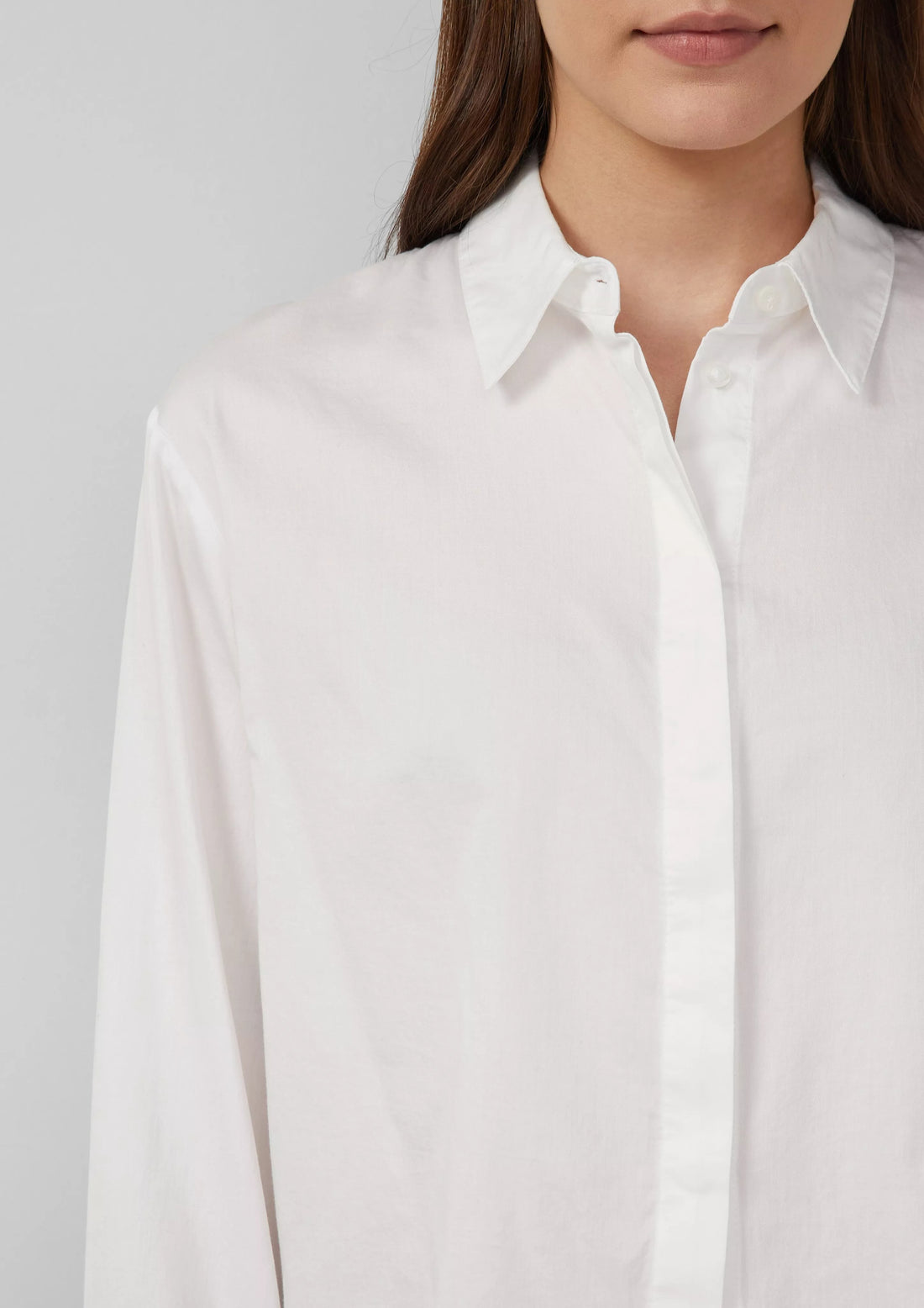 Cropped blouse with concealed button placket